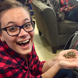 Sydoney Blackmore holds a small turtle