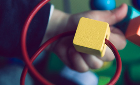 Child playing with a block game