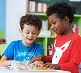 two students read a book