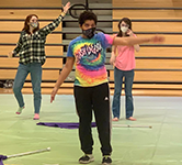 High school students experiencing disabilities participate in color guard