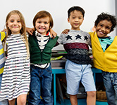 elementary students stand side-by-side