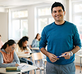 teacher stands in front of students