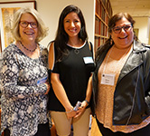 Karen Foley, Sara Chacon Diaz and Rosa Gilbert smile for camera