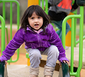 preschooler on playground at nestucca valley early learning center