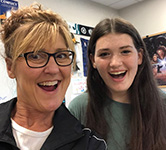 heather hummell martin takes a selfie with a student