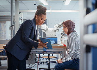 a teacher and a student work on an advancing manufacturing project