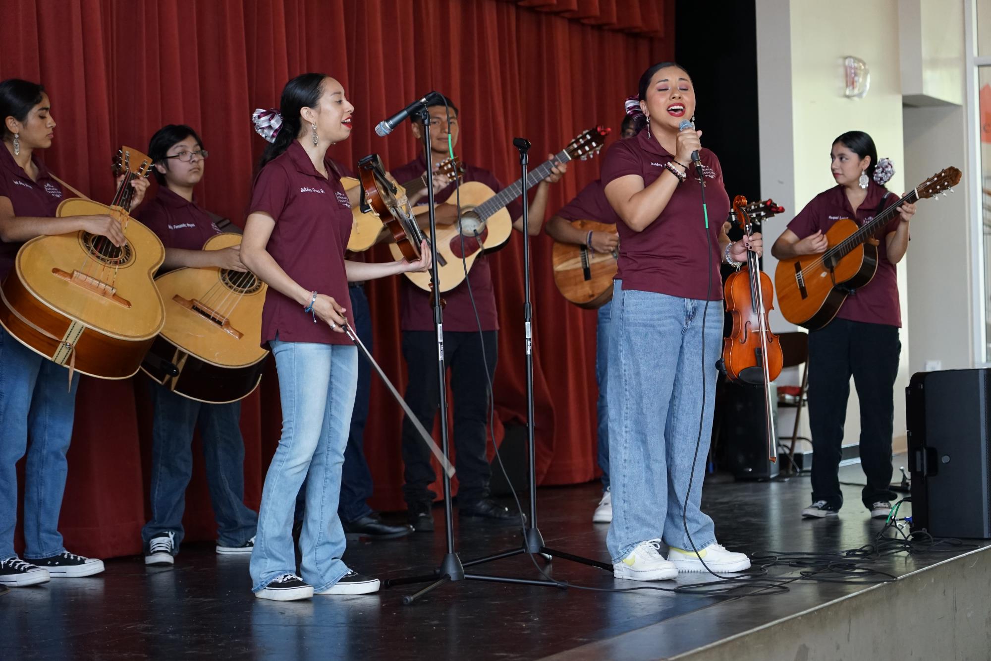 a mariachi band performs on stage