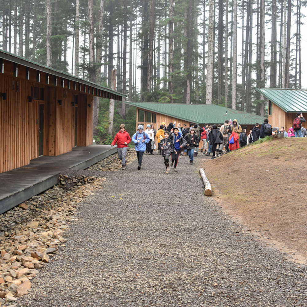 Meriwether buildings with students walking on a gravel path