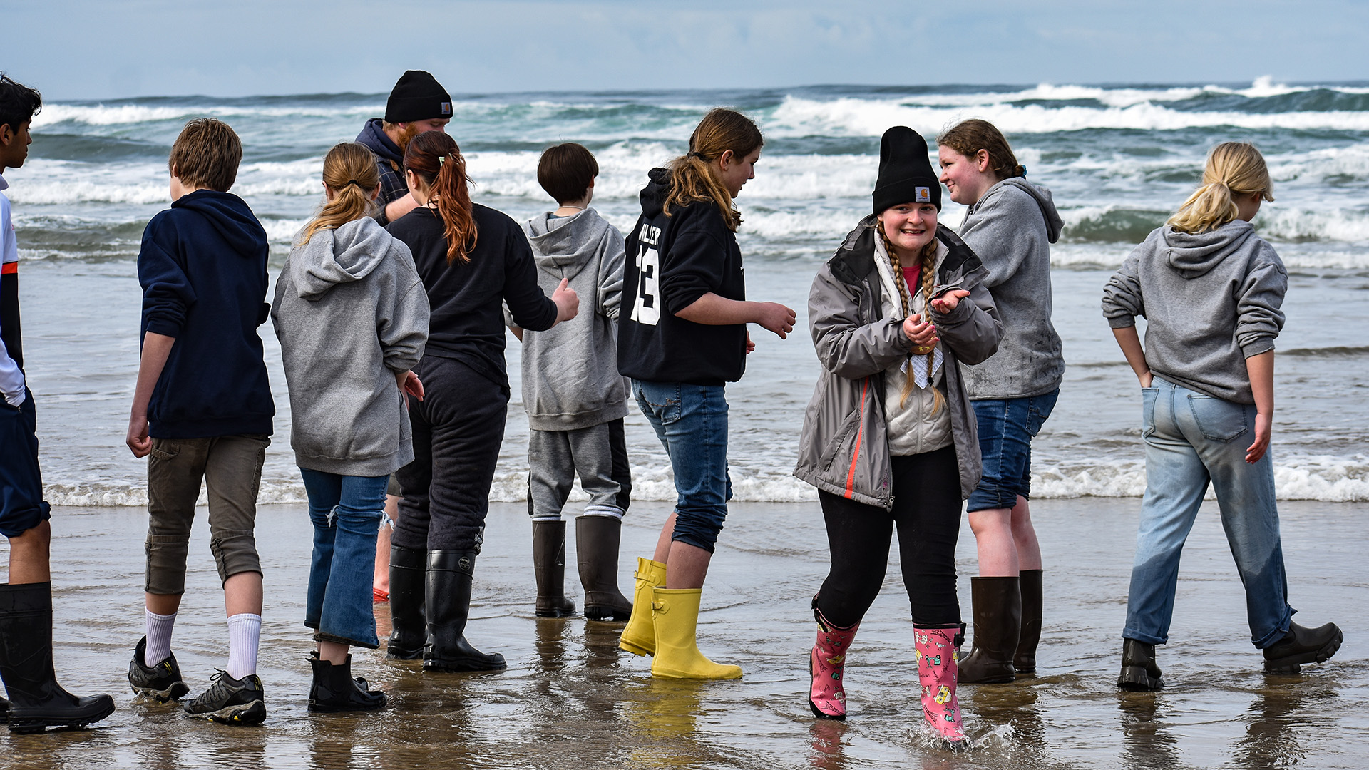 students in the surf