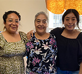 Sabi Velasco and her daughters Yesenia Flores and Saray Flores pose for a photo