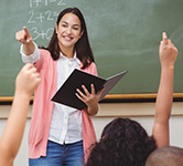 teacher calls on students who are raising their hands