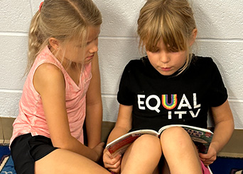 students read a book together