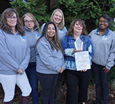 human resources team poses for a photo outside the washington service center