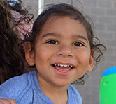 preschooler smiles for the camera