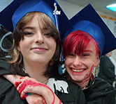 Beck and Ryan don their graduation caps and smile for the camera