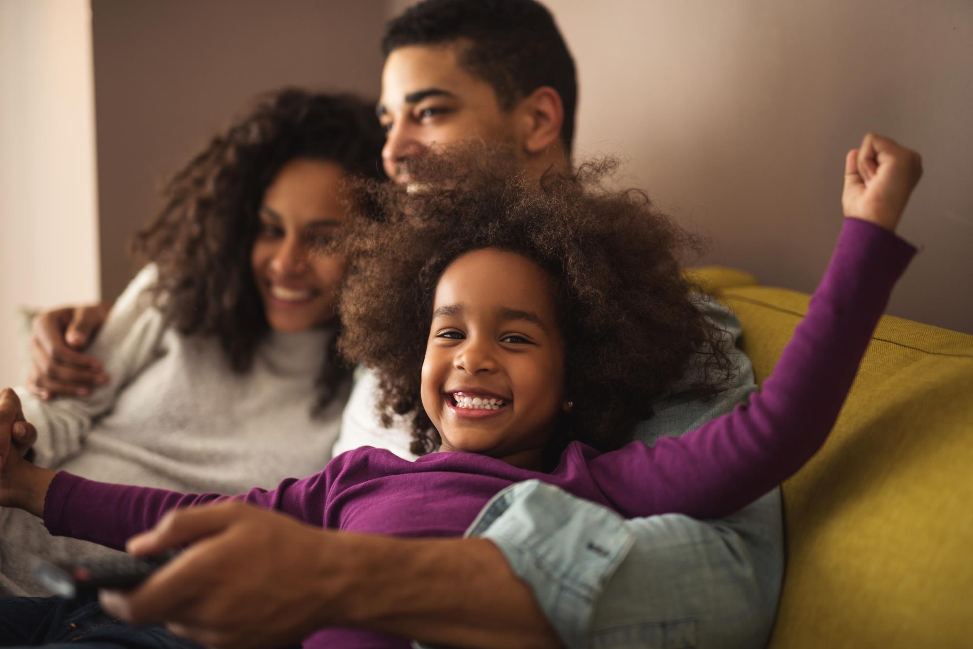 a child hangs out with her parents