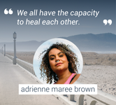 a photo of adrienne maree brown with seaside boardwalk in background