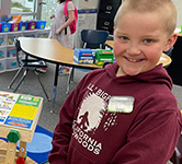 a student with his construction project