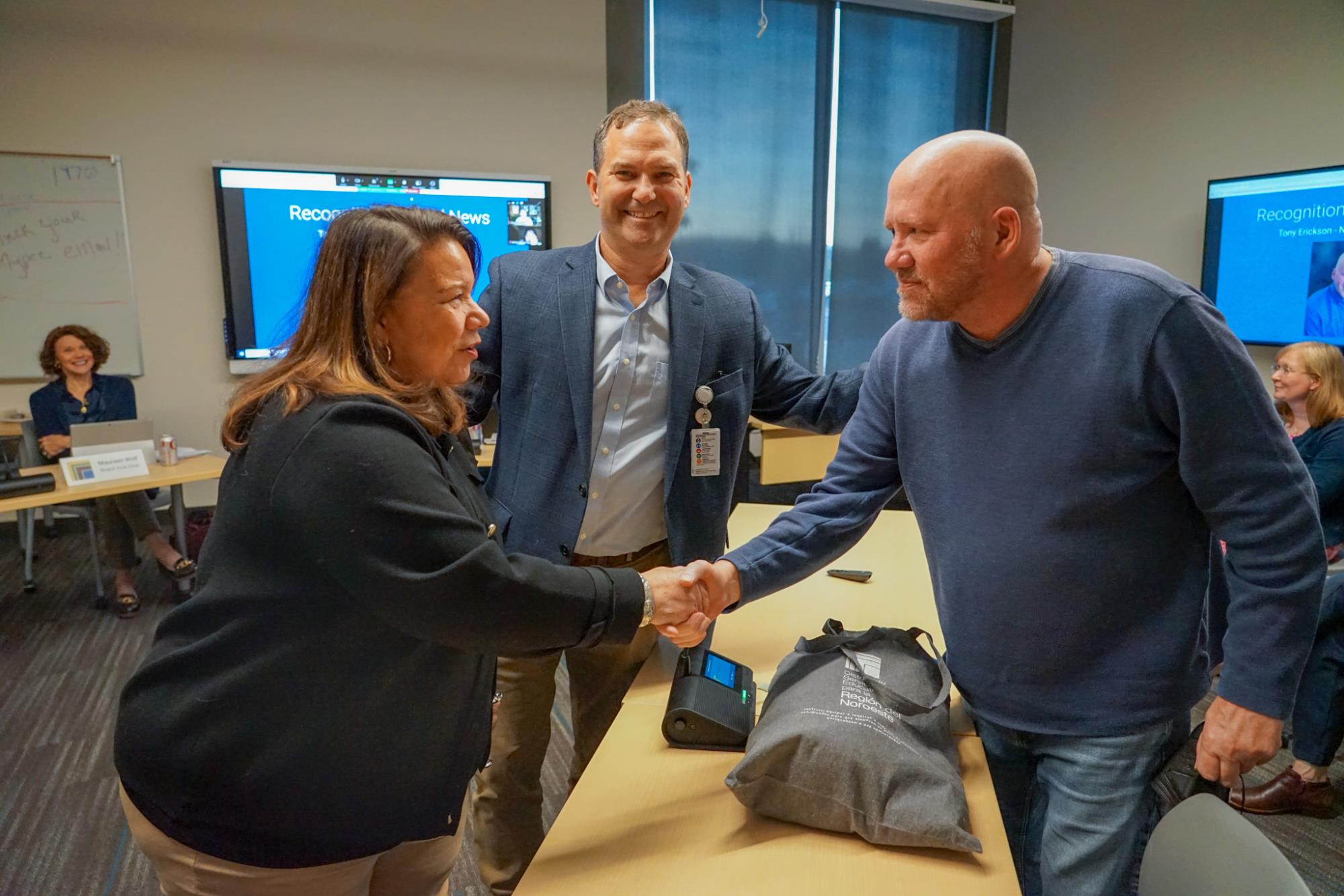 From left, Chair Becky Tymchuk, Superintendent Dan Goldman, outgoing board member Tony Erickson