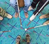 white canes and feet on pdx carpet