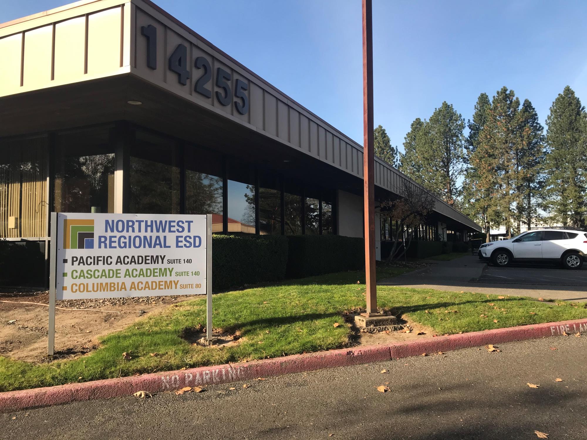 Outside of Cascade and Pacific academies on a sunny day